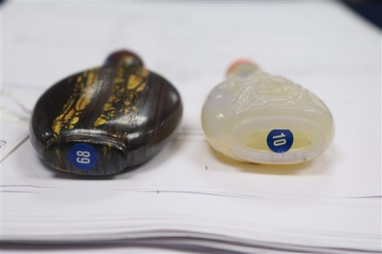 A Chinese carved opal snuff bottle and tigers eye mineral snuff bottle, early 20th century 6.5cm and 7.1cm